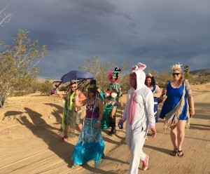 Mermaids stroll thru the Joshua Tree, California for artist Aaron Shepard's inaugural parade, Bearded and Shucked. Image by Laura Henkel