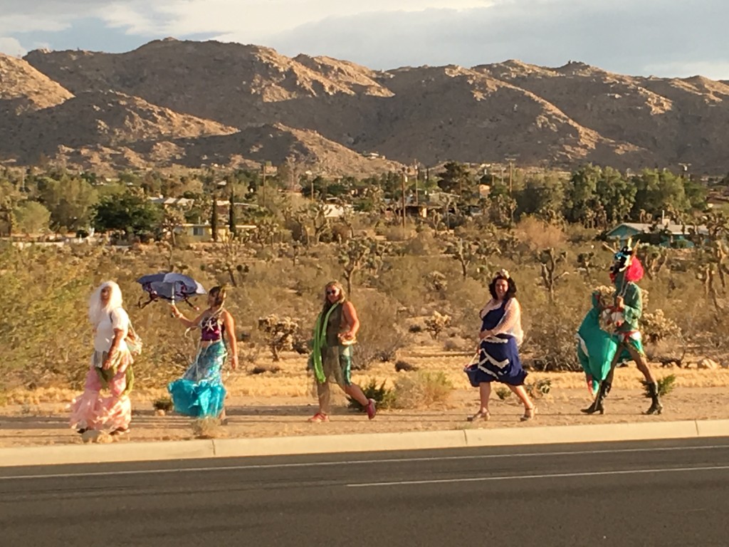 Mermaids stroll thru the Joshua Tree, California for artist Aaron Shepard's inaugural parade, Bearded and Shucked. Image by Laura Henkel